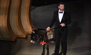 Jimmy Kimmel appeared onstage with a donkey which he claimed was Jenny -- the beloved pet of Colin Farrell's character in best picture nominee "The Banshees of Inisherin." Jenny had been allowed to fly from Ireland because she is "a certified emotional support donkey, or at least that's what we told the airline," Mr. Kimmel joked.